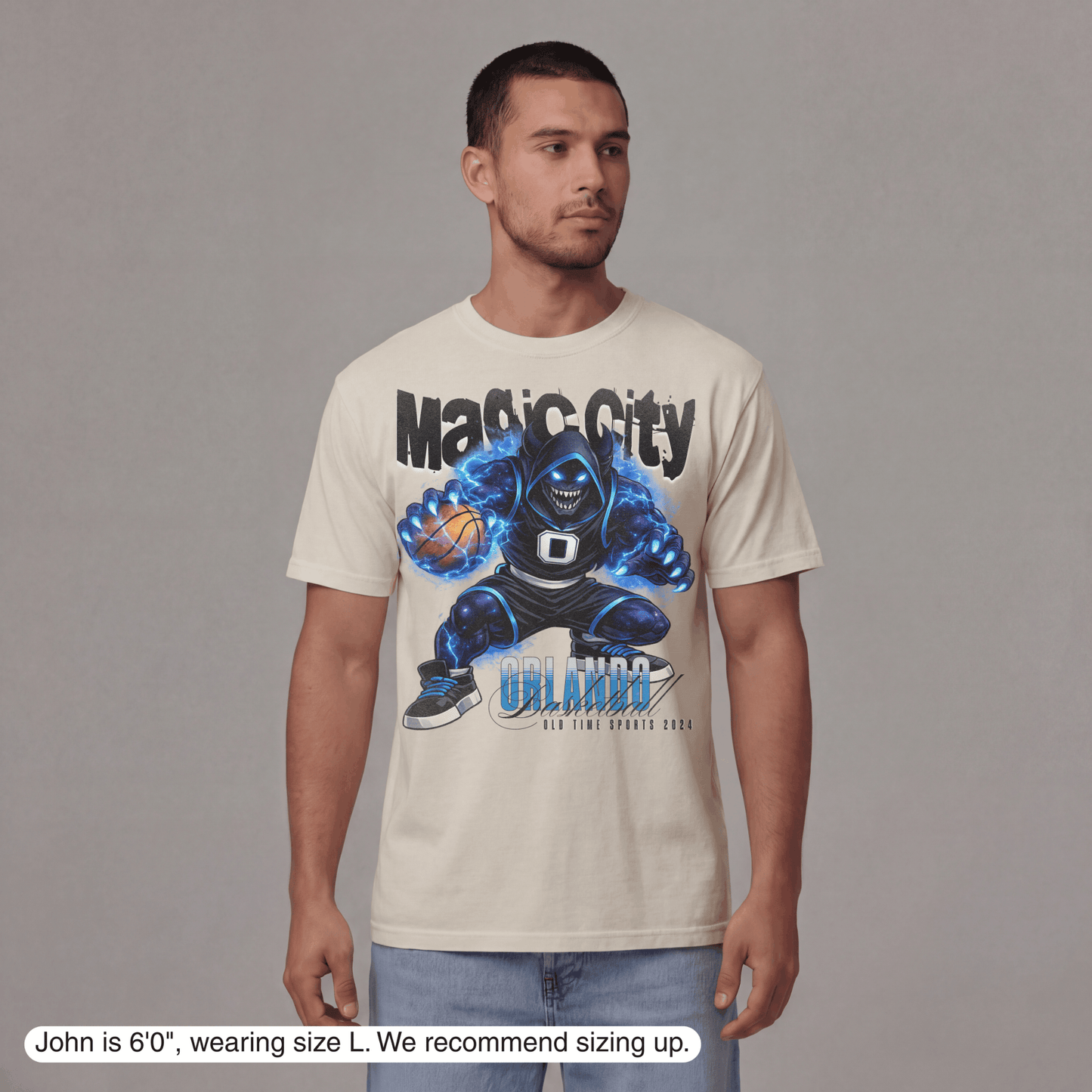 Man wearing a t-shirt with a graphic design and text, standing against a plain background.