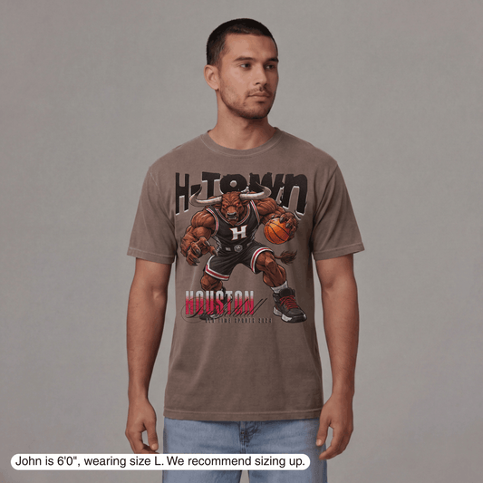 Man wearing a t-shirt with a graphic design on a gray background