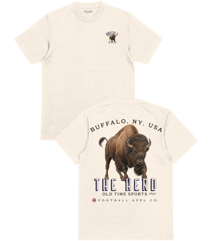 Two views of a cream-colored t-shirt on a white background, showing the front with a small buffalo graphic and the back with a large buffalo graphic and text reading 'BUFFALO, NY, USA THE HERD OLD TIME SPORTS 1967 FOOTBALL APPL CO.'.