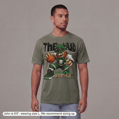 Man wearing a green t-shirt with a graphic design on a gray background