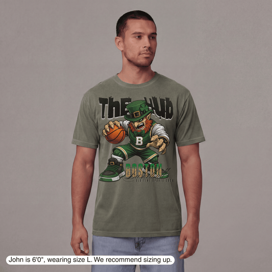 Man wearing a green t-shirt with a graphic design on a gray background