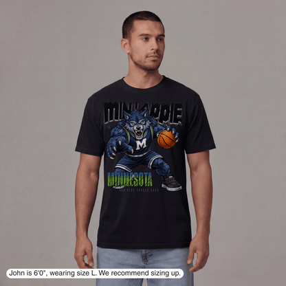 Man wearing a black t-shirt with a graphic design on a gray background