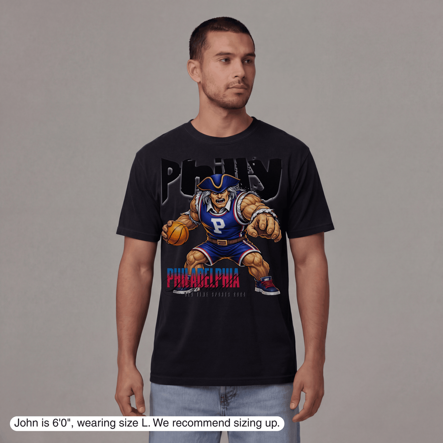 Man wearing a black t-shirt with a graphic design on a gray background