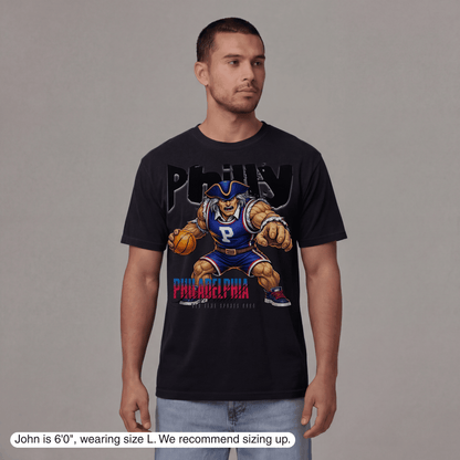 Man wearing a black t-shirt with a graphic design on a gray background