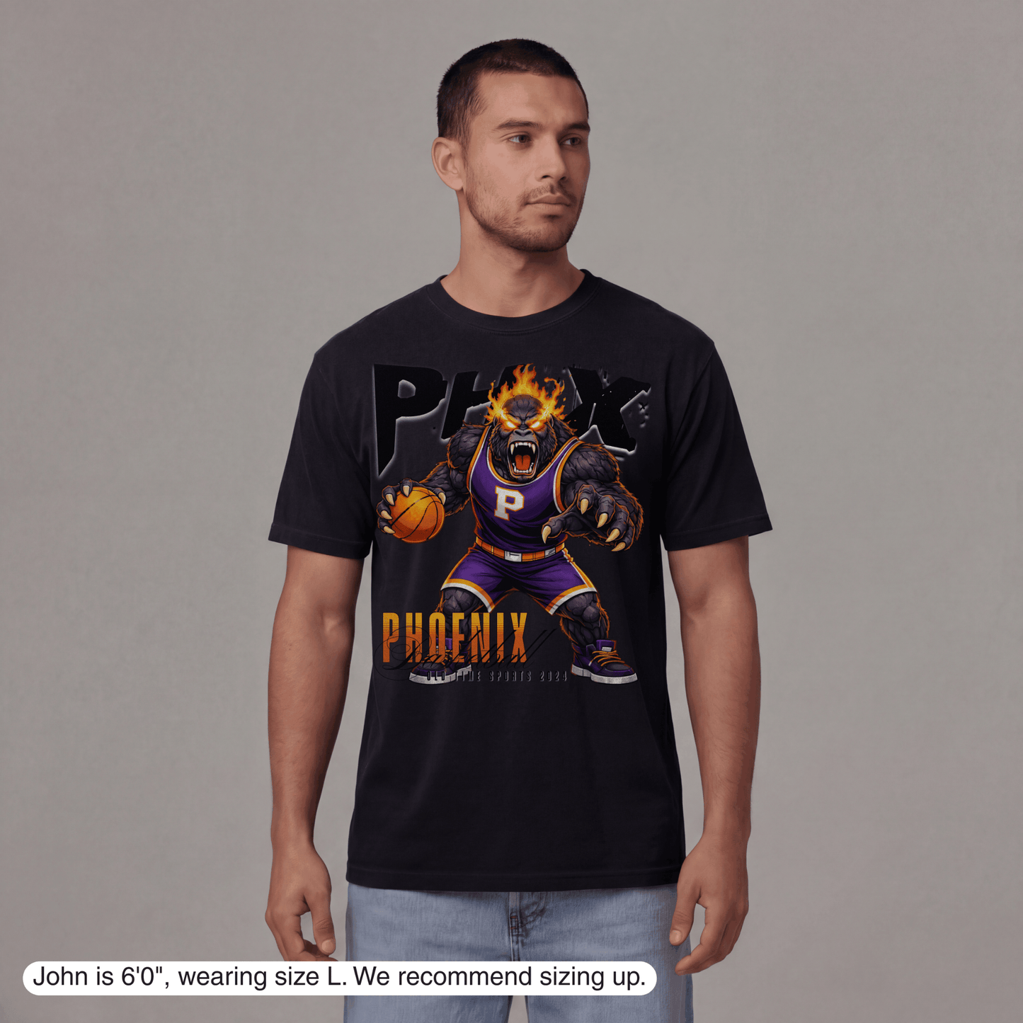 Man wearing a black t-shirt with a graphic design of a phoenix and basketball player on a gray background