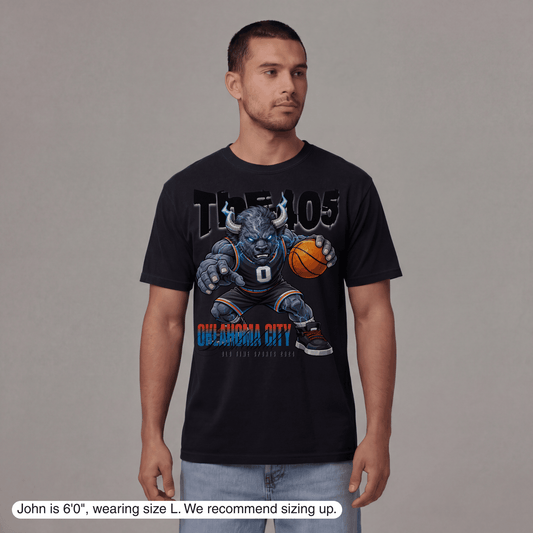 Man wearing a black t-shirt with a graphic design on a gray background