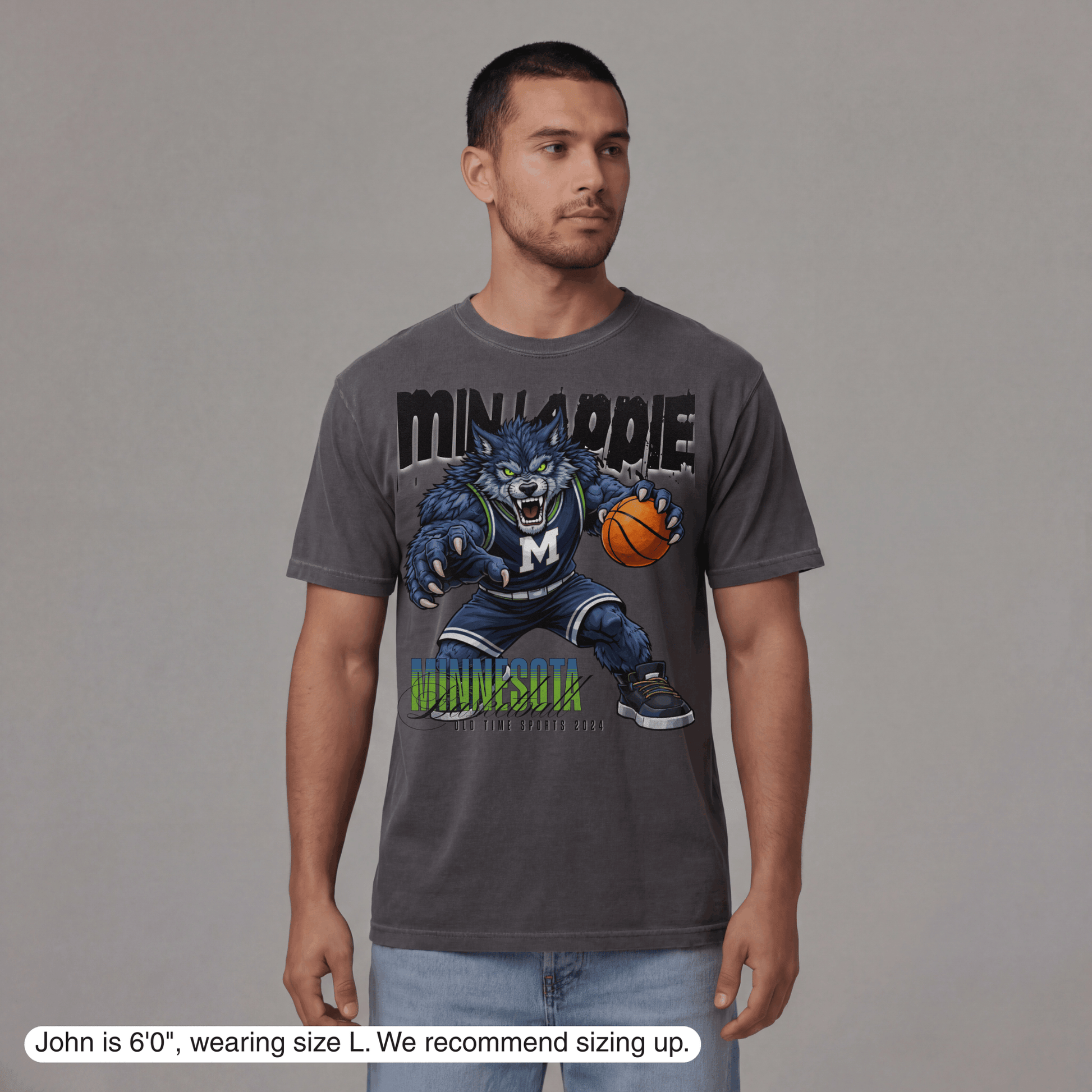 Man wearing a gray t-shirt with a graphic design on a gray background