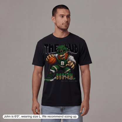 Man wearing a black t-shirt with a graphic design on a gray background