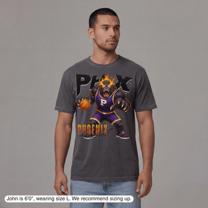 Man wearing a gray t-shirt with a graphic design on a gray background