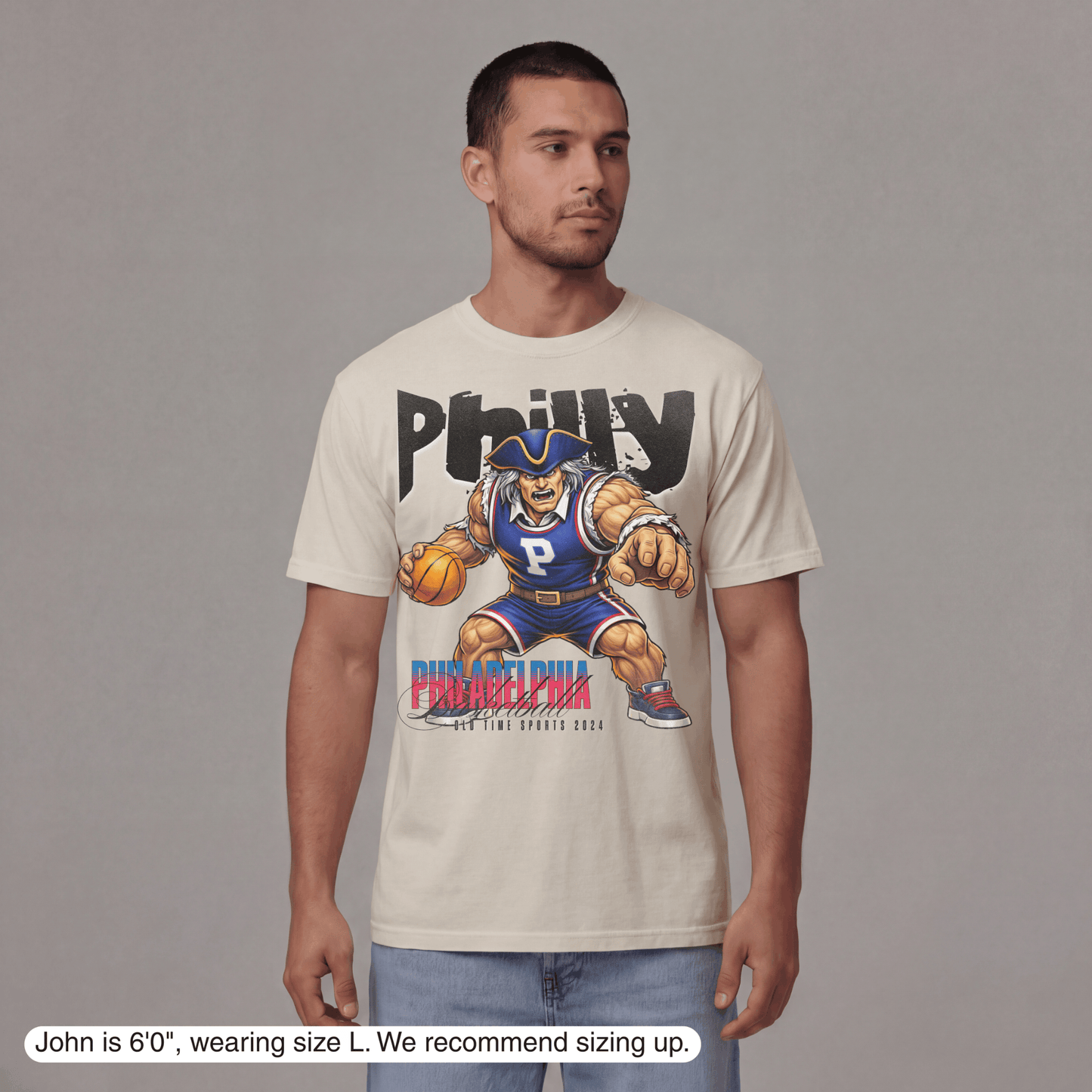 Man wearing a t-shirt with a graphic design on a plain background