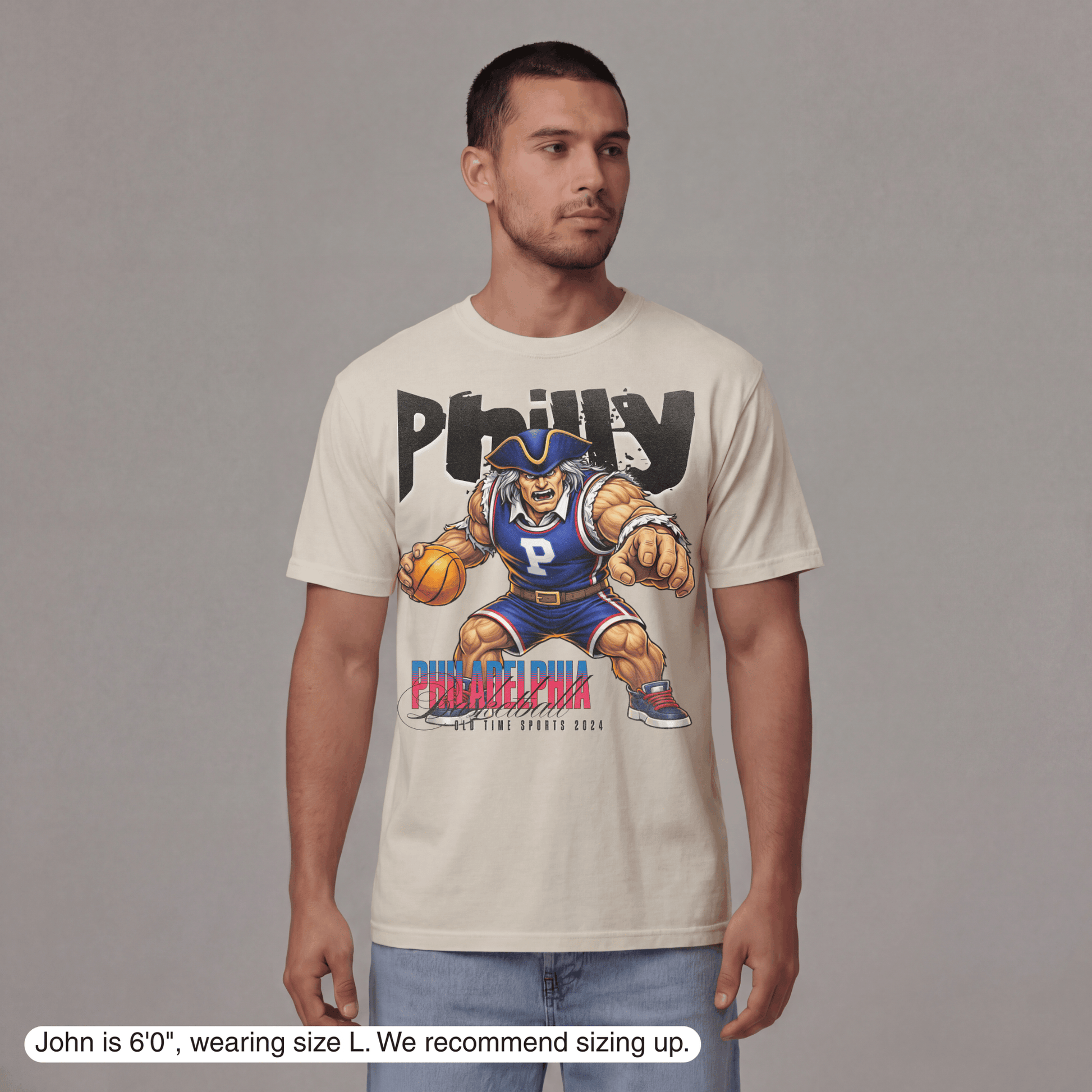 Man wearing a t-shirt with a graphic design on a plain background