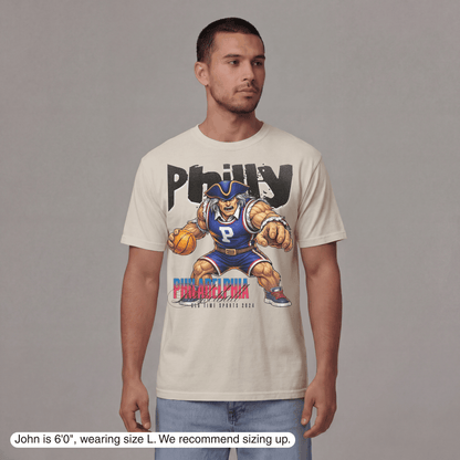 Man wearing a t-shirt with a graphic design on a plain background