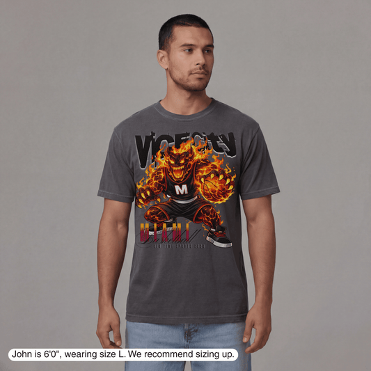 Man wearing a gray t-shirt with a graphic design on a plain background