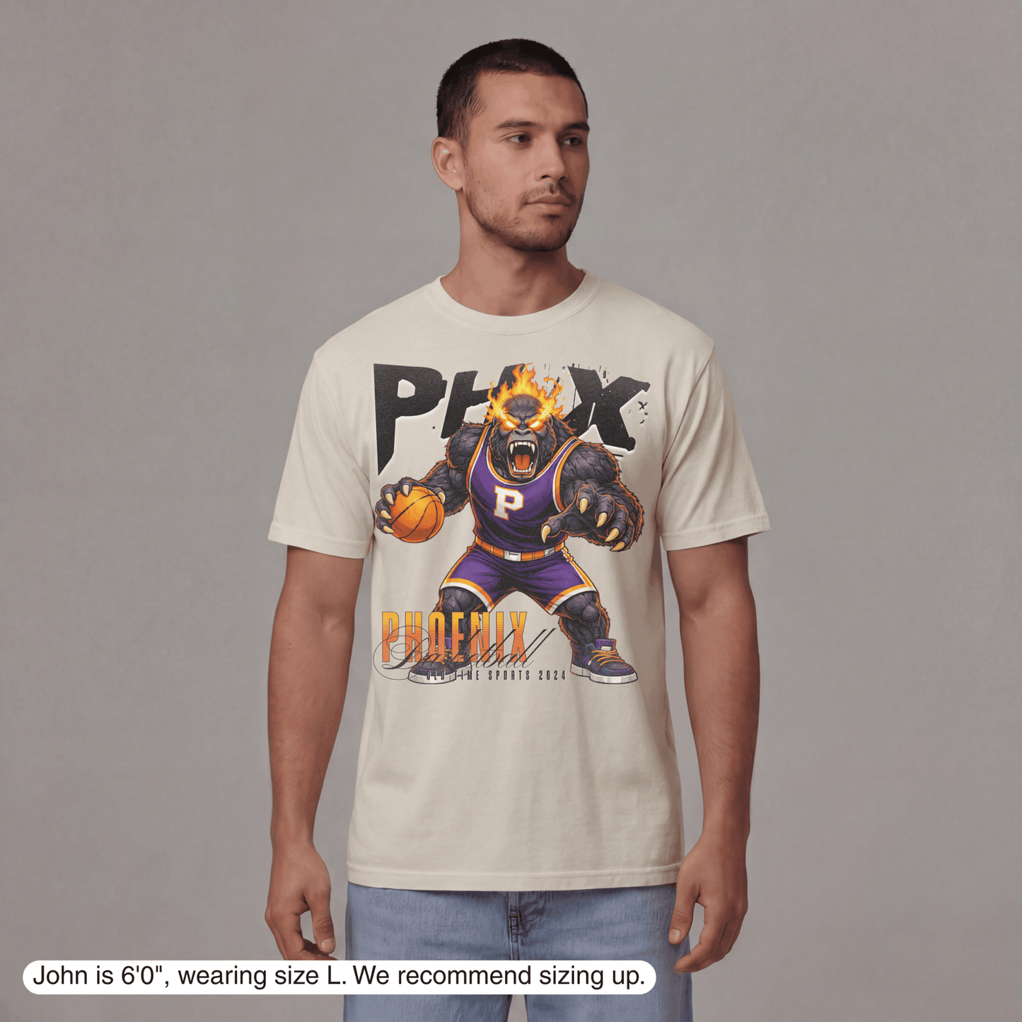 Man wearing a t-shirt with a graphic design of a phoenix basketball player on a gray background