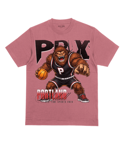 Pink t-shirt with a bear holding a basketball and 'Portland' text on a clear background