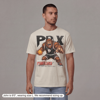 Man wearing a t-shirt with a graphic design on a gray background