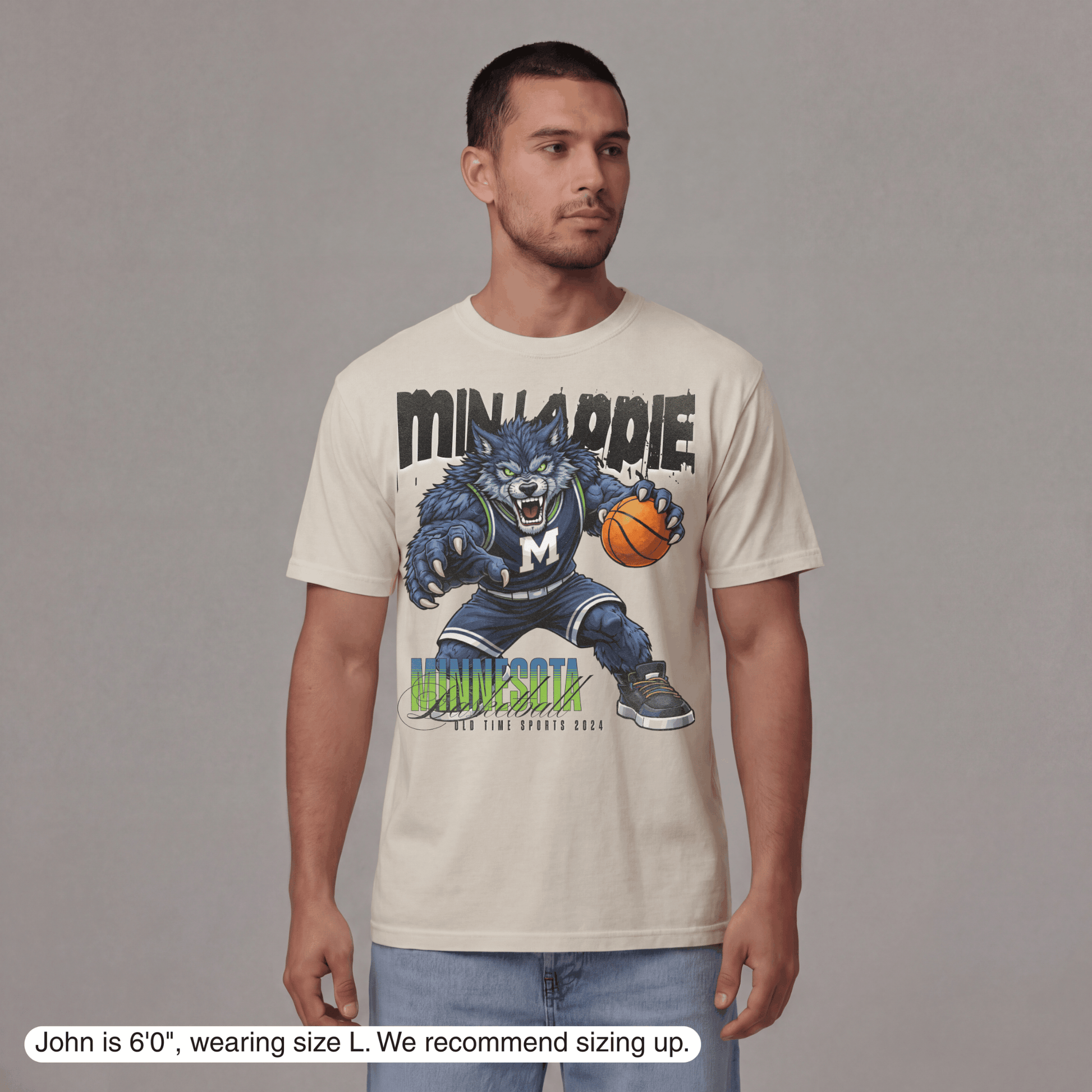 Man wearing a t-shirt with a graphic design of a blue monster holding a basketball, with text 'Minipennie' and 'Minnipennie'.