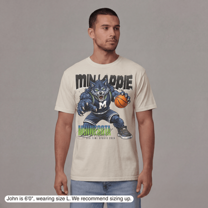 Man wearing a t-shirt with a graphic design of a blue monster holding a basketball, with text 'Minipennie' and 'Minnipennie'.