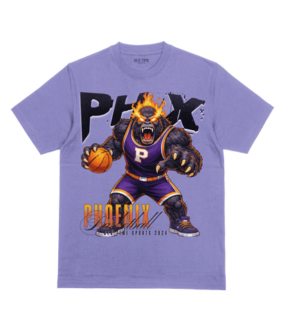 Purple t-shirt with a bear holding a basketball and 'PHX Phoenix' text on a clear background