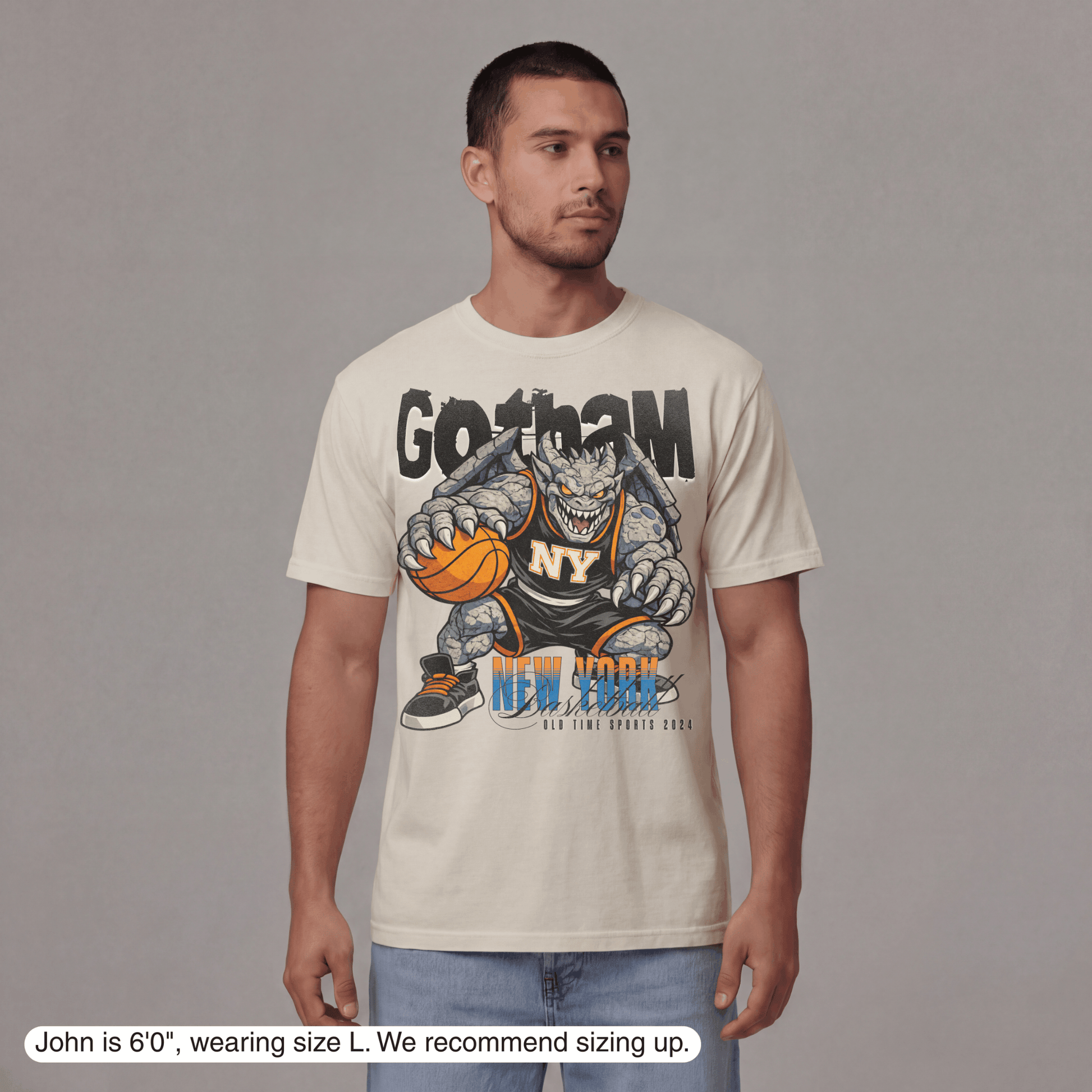 Man wearing a t-shirt with a graphic design on a plain background