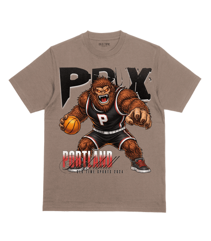T-shirt with a bear-like character holding a basketball and 'PRYX' branding on a beige background