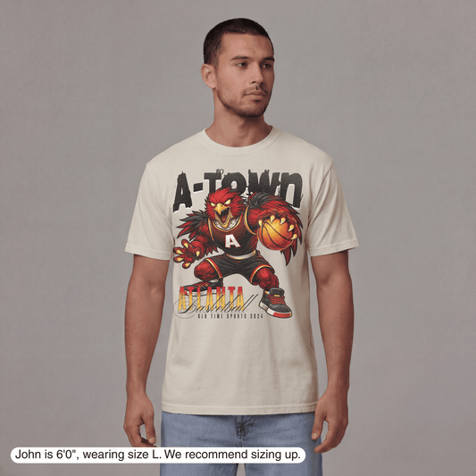 Man wearing a t-shirt with a graphic design on a gray background