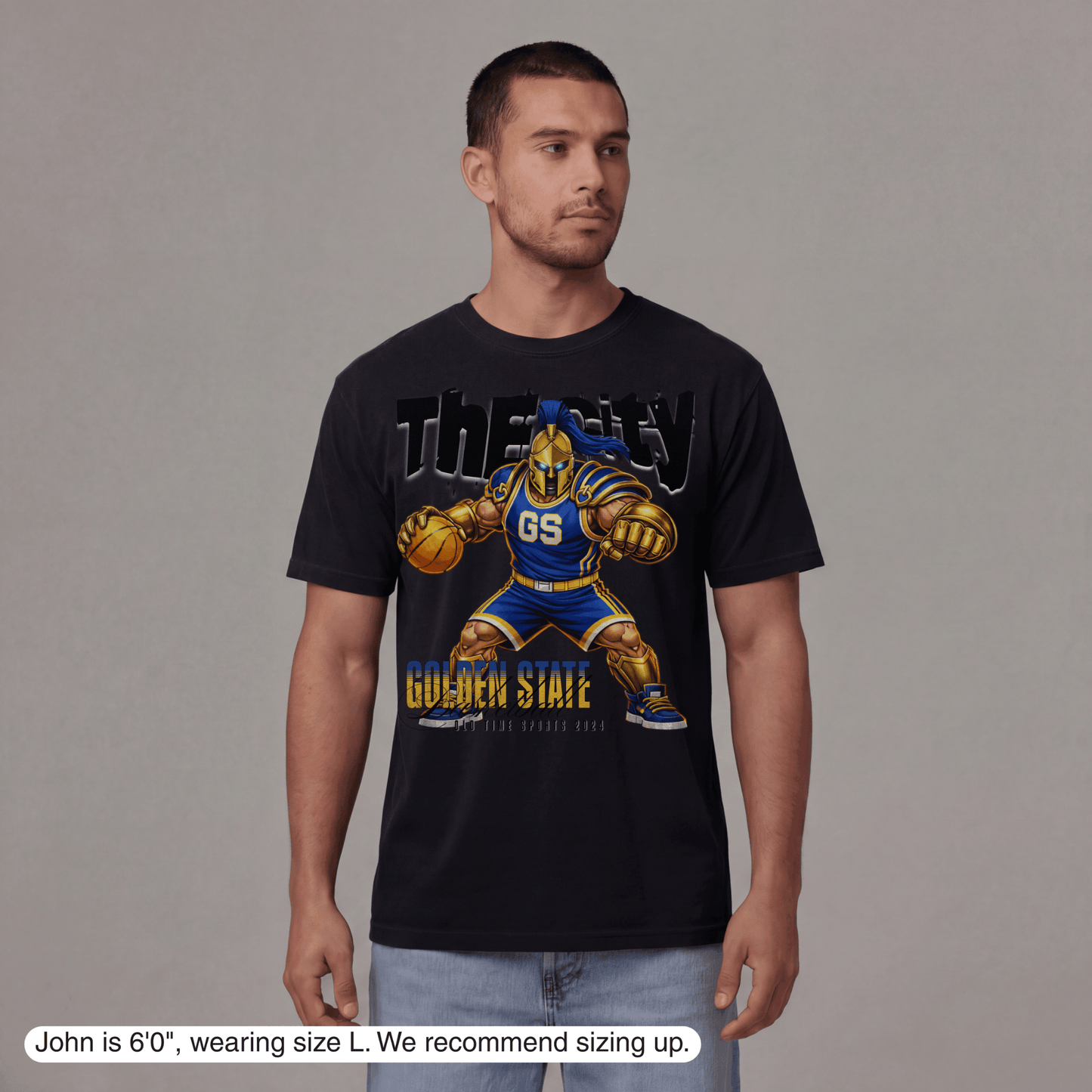 Man wearing a black t-shirt with a graphic design of a basketball player and text on a gray background