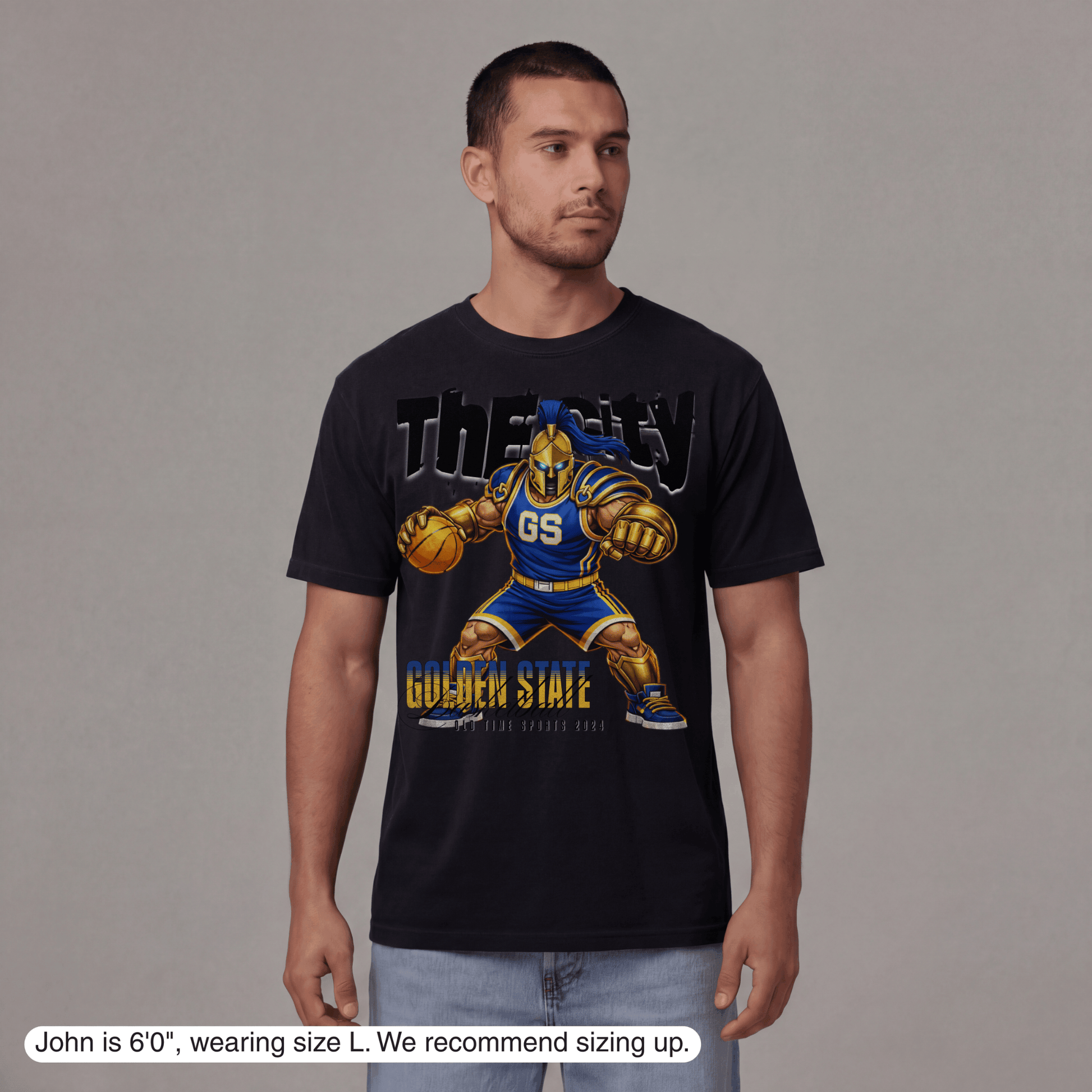 Man wearing a black t-shirt with a graphic design of a basketball player and text on a gray background